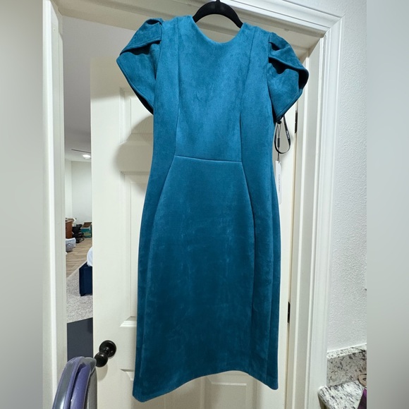 Calvin Klein Dresses & Skirts - Calvin Klein teal suede dress with tulip sleeve. Size 2. NWT. smoke free home.